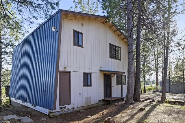 a front view of a house with parking space