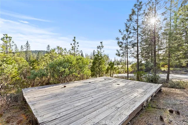 a view of a backyard with sitting area