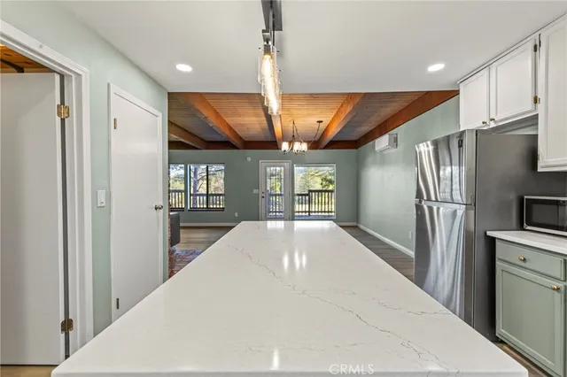 a kitchen with stainless steel appliances granite countertop a sink and cabinets