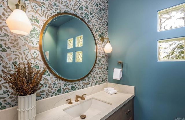 an bathroom with a sink and mirror