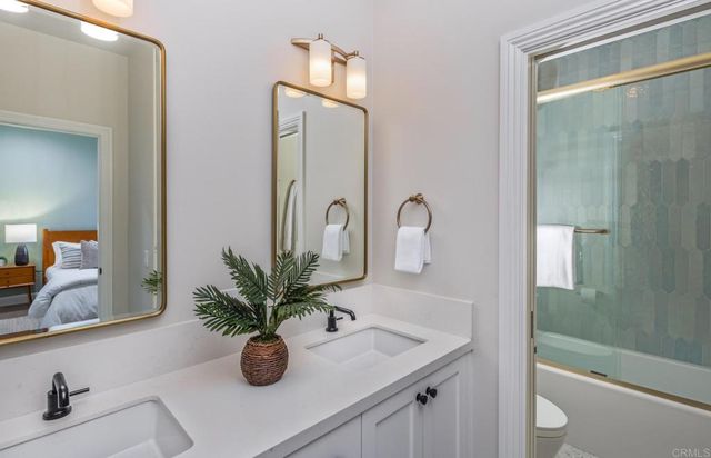 a bathroom with a sink a vanity and a mirror