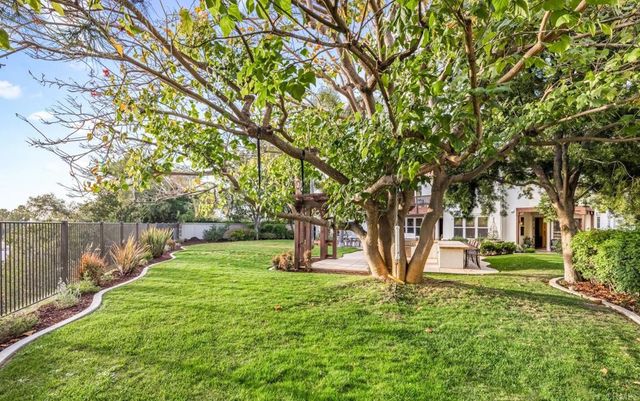 a view of a backyard with large trees