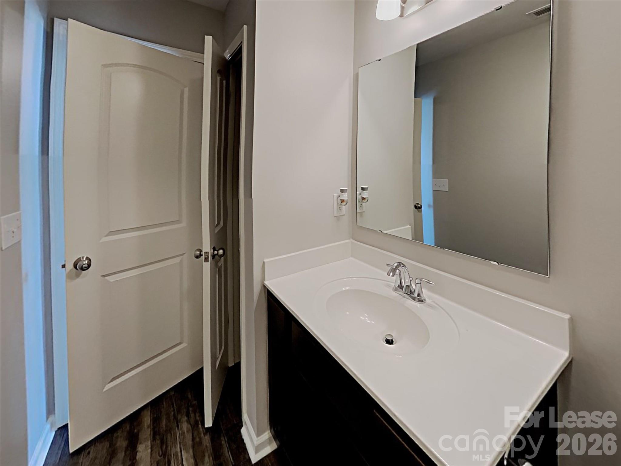 543 Contentment Drive Locust, NC 28097 - Photo 13 of 36 a bathroom with a sink and a mirror