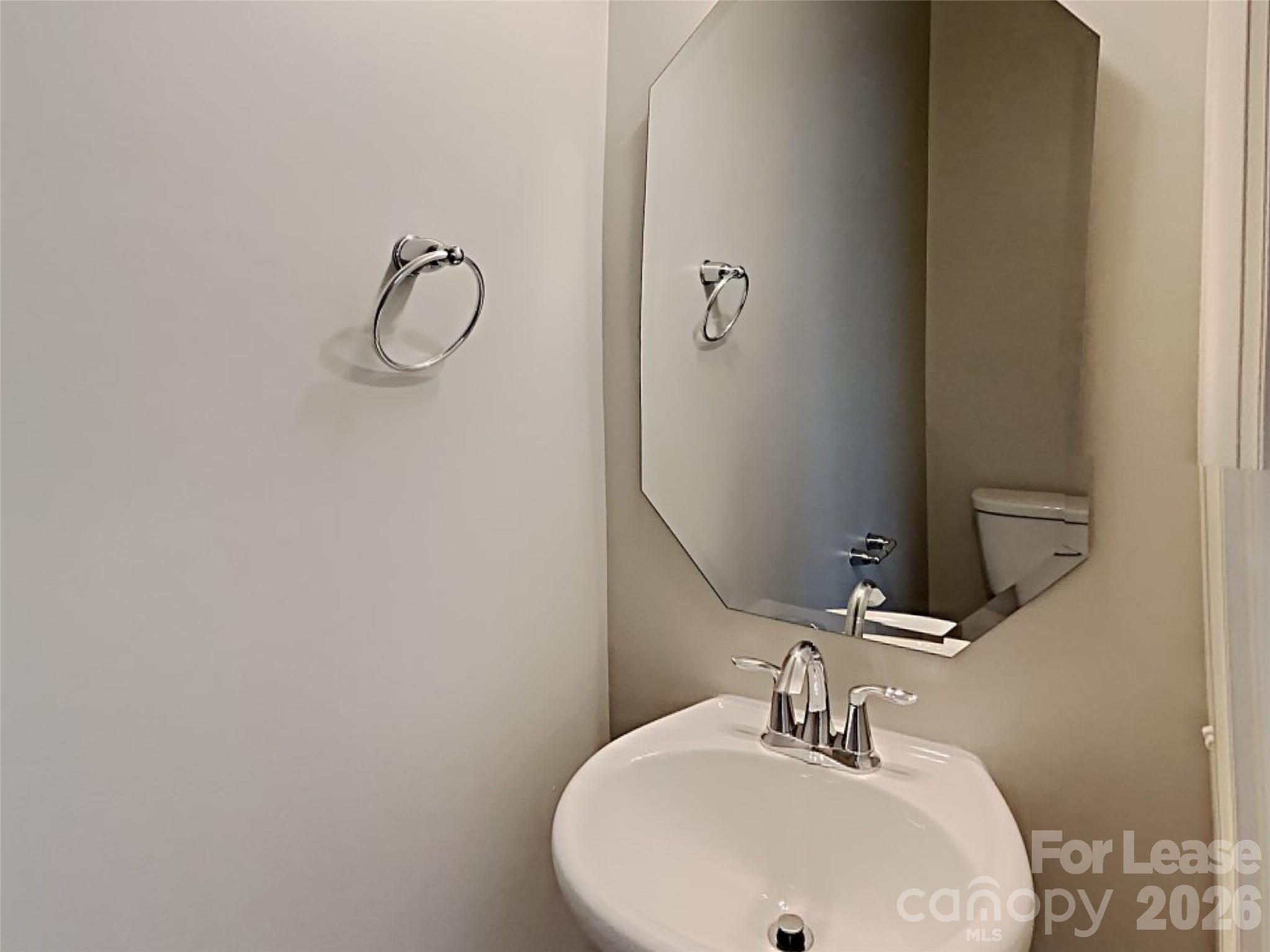 543 Contentment Drive Locust, NC 28097 - Photo 14 of 36 a bathroom with a sink and a mirror