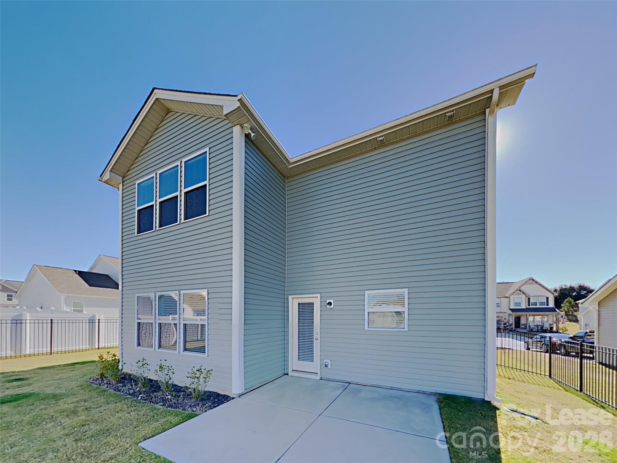 543 Contentment Drive Locust, NC 28097 - Photo 20 of 36 a front view of a house with garden