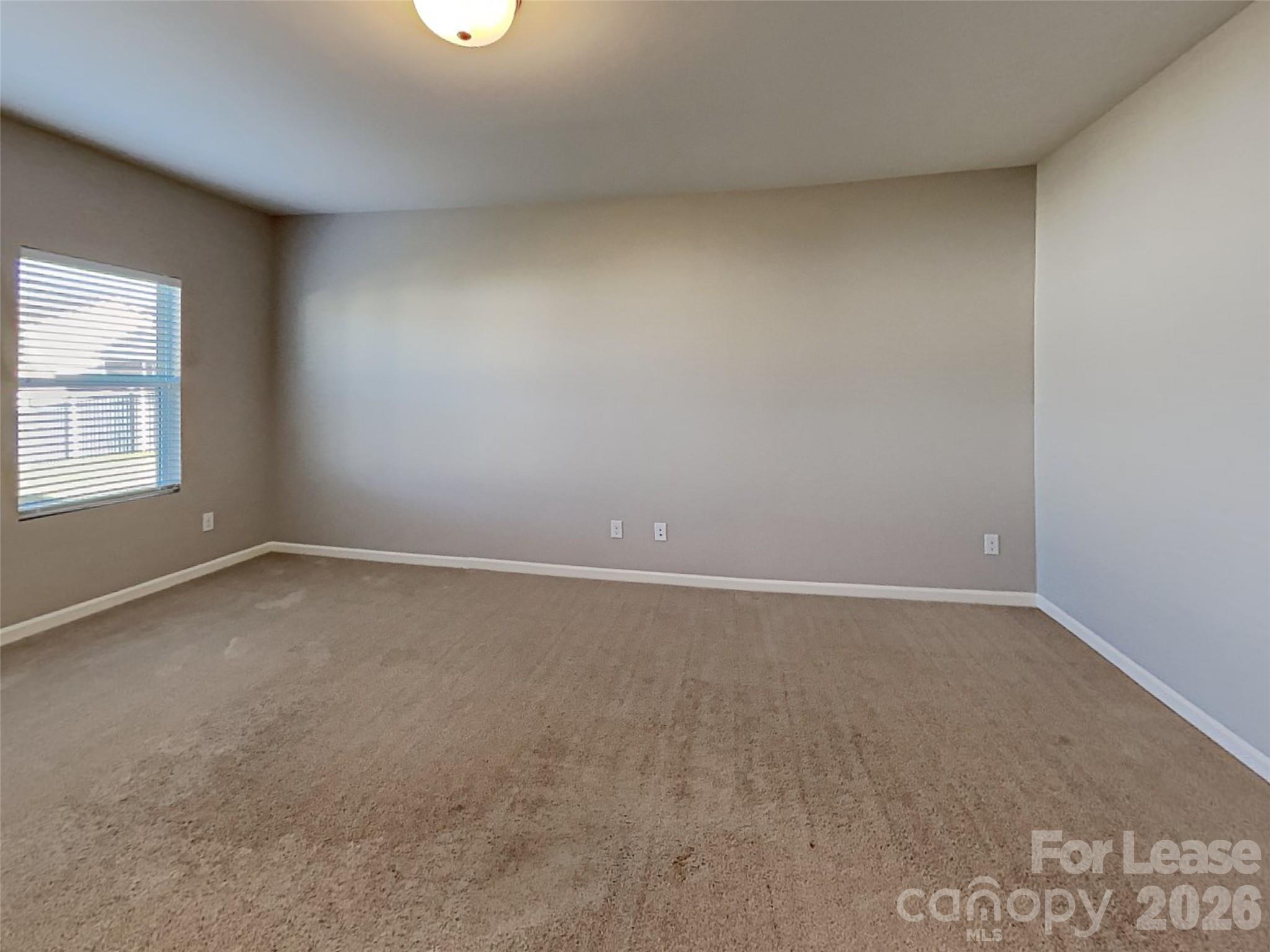 543 Contentment Drive Locust, NC 28097 - Photo 23 of 36 an empty room with a window