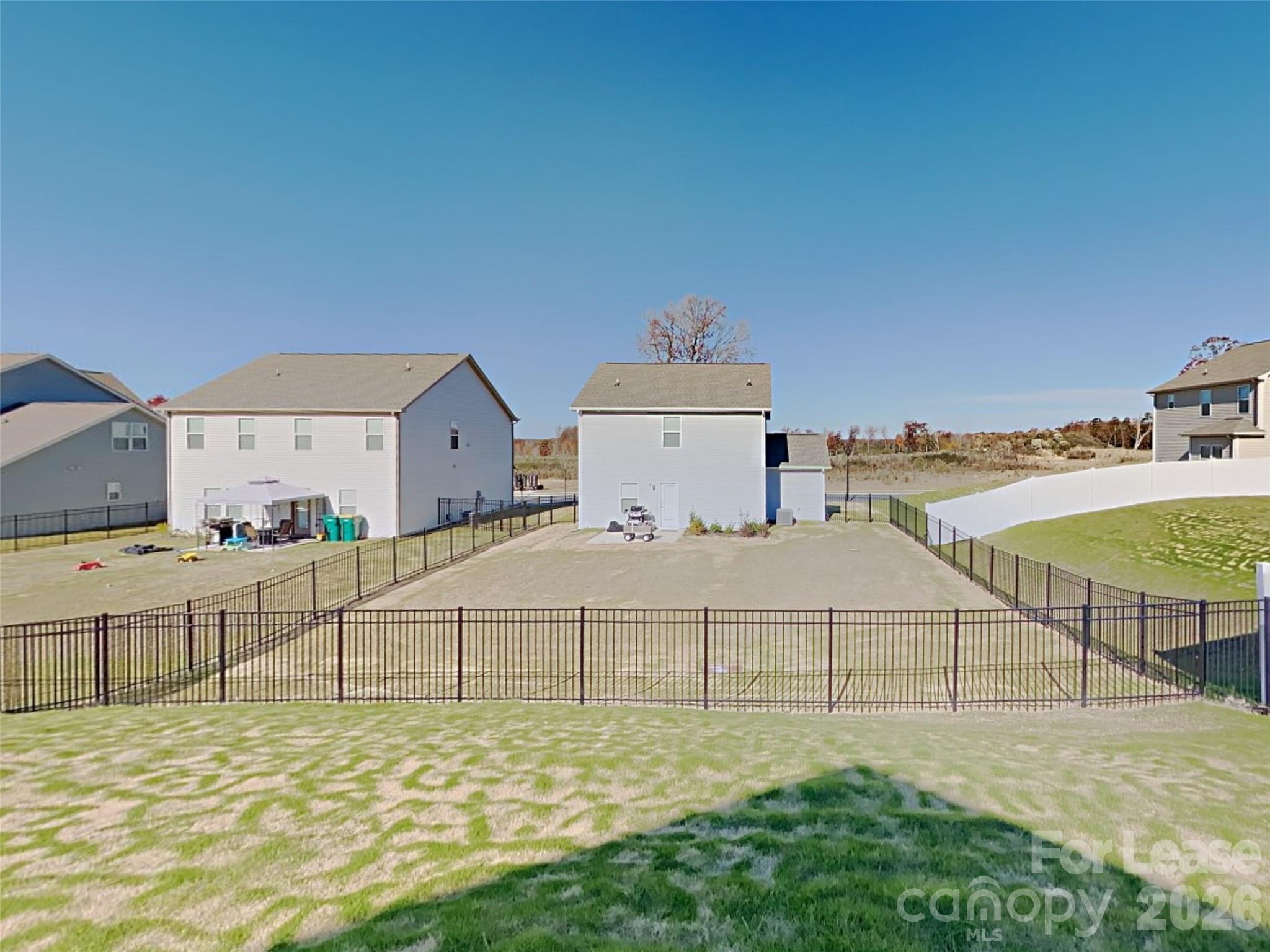 543 Contentment Drive Locust, NC 28097 - Photo 27 of 36 a bed room with a bed and a flat tv screen on dresser