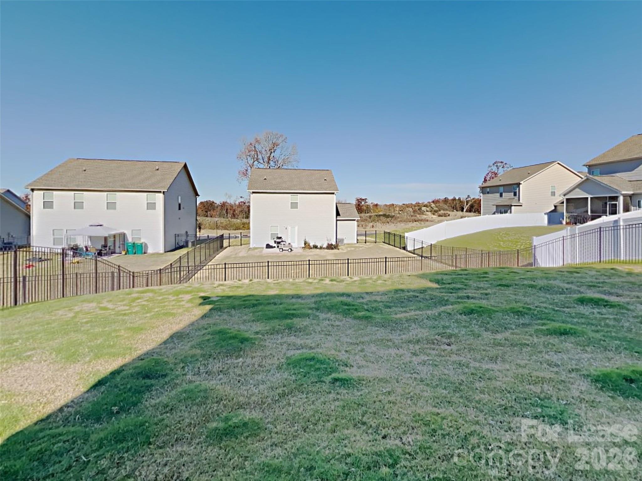 543 Contentment Drive Locust, NC 28097 - Photo 28 of 36 a view of a house with a yard and a large tree