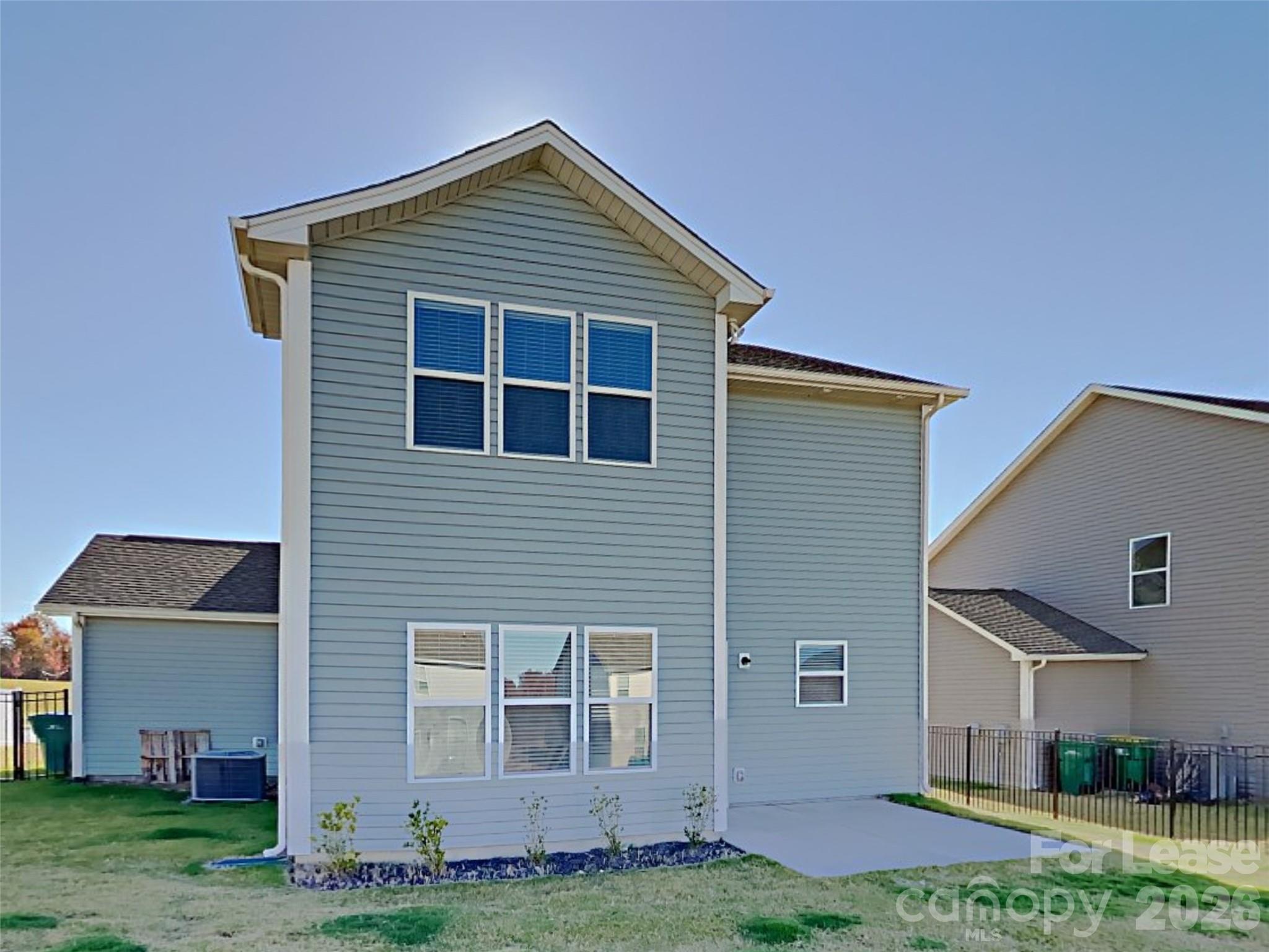 543 Contentment Drive Locust, NC 28097 - Photo 36 of 36 a front view of a house with a yard