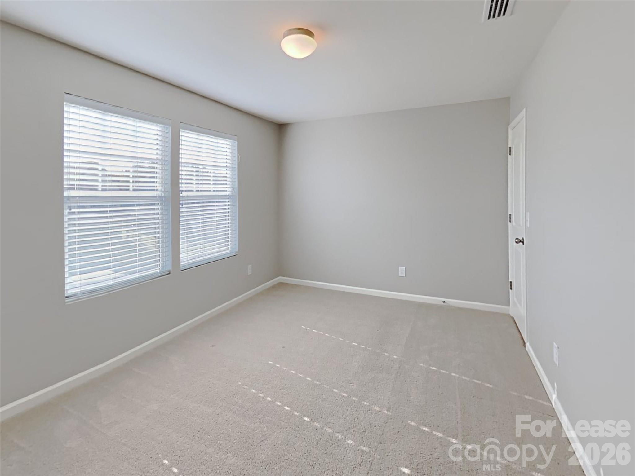 543 Contentment Drive Locust, NC 28097 - Photo 8 of 36 an empty room with a window