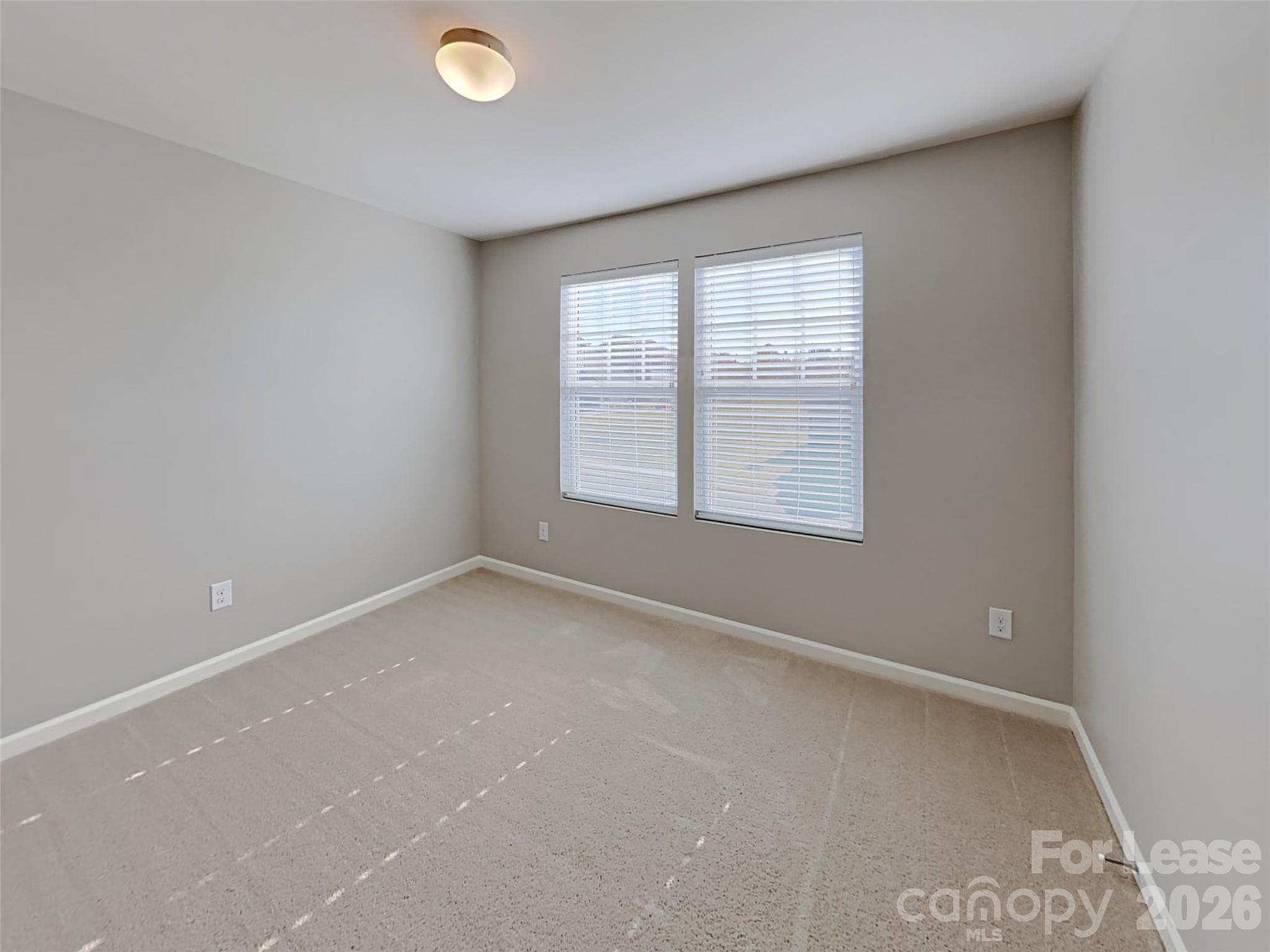 543 Contentment Drive Locust, NC 28097 - Photo 9 of 36 an empty room with a window