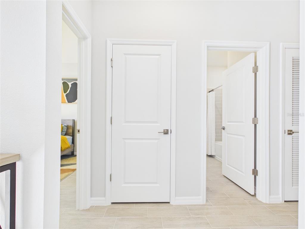7348 Southwest 134th Street Ocala, FL 34473 - Photo 27 of 49 a view of a bedroom from the hallway