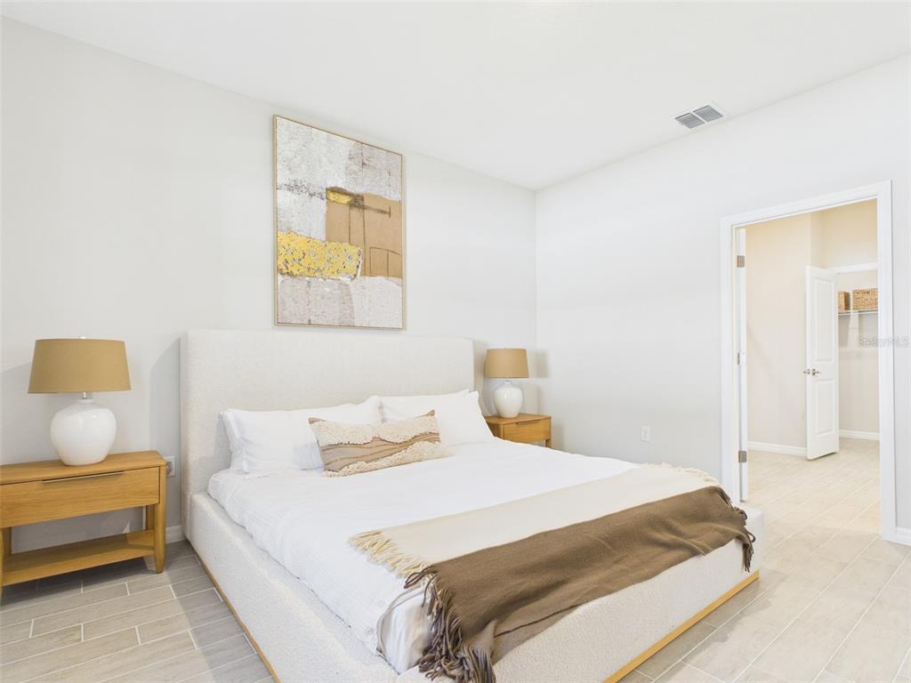 7348 Southwest 134th Street Ocala, FL 34473 - Photo 30 of 49 a bedroom with bed and window