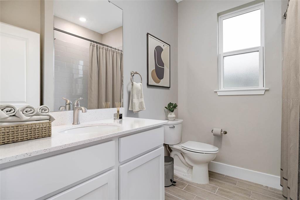 7348 Southwest 134th Street Ocala, FL 34473 - Photo 45 of 49 a bathroom with a toilet a sink and mirror
