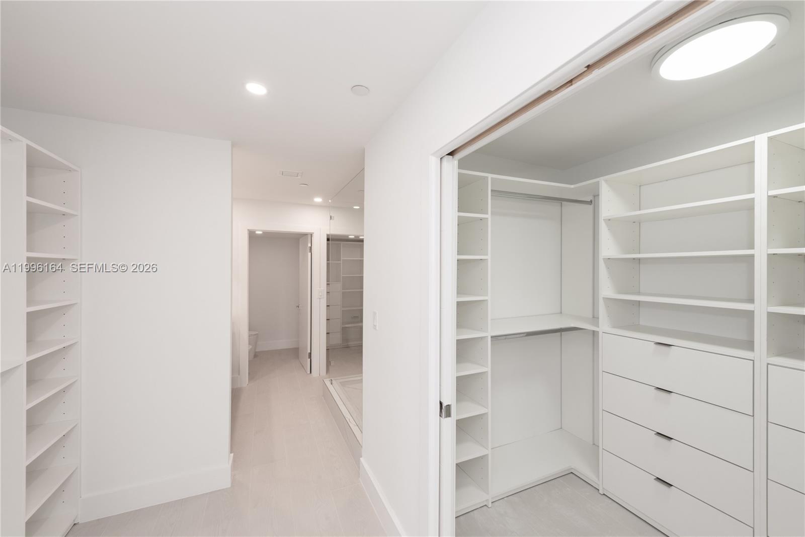 151 Crandon Boulevard, Unit 241 Key Biscayne, FL 33149 - Photo 13 of 28 a view of walk in closet with empty racks