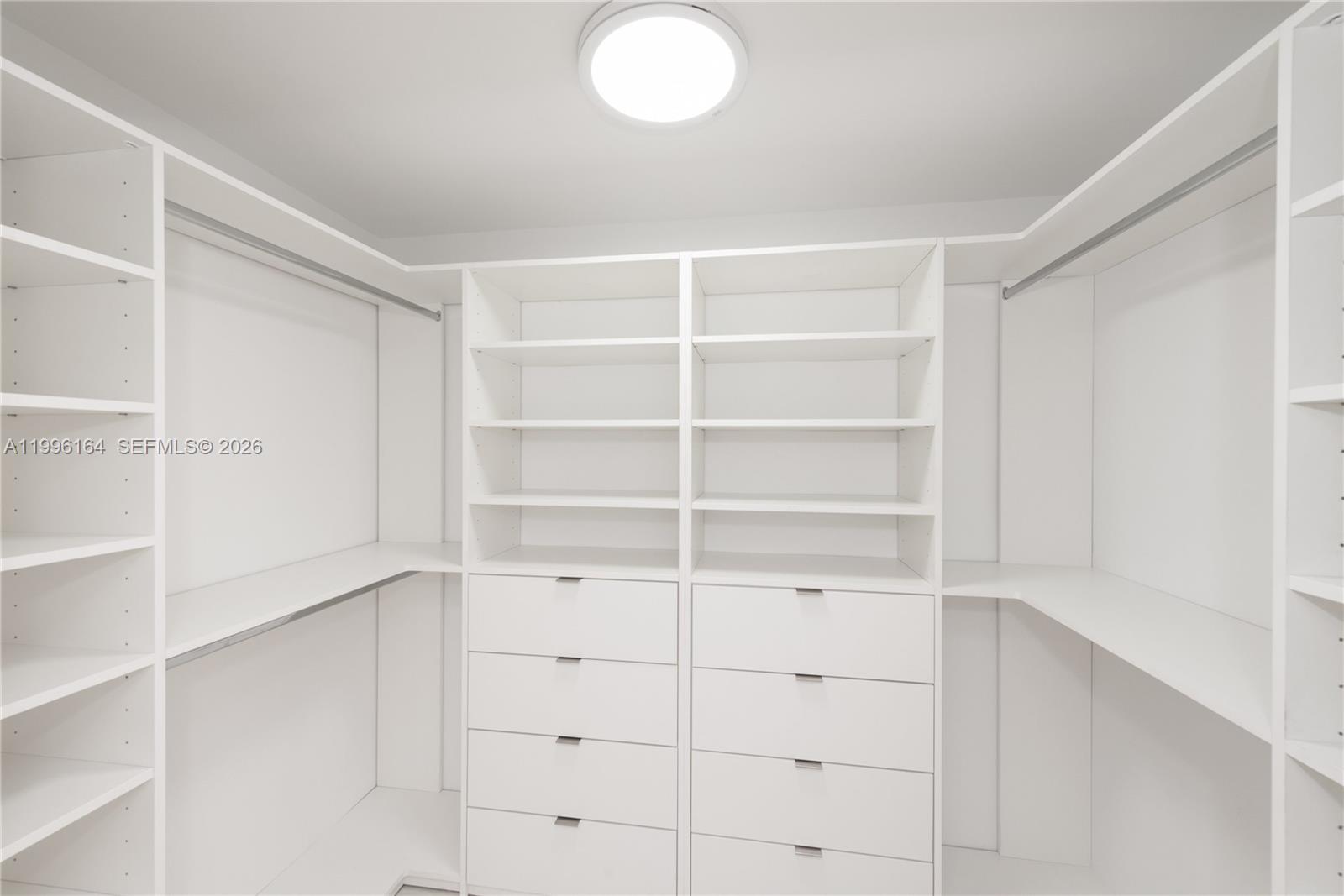 151 Crandon Boulevard, Unit 241 Key Biscayne, FL 33149 - Photo 14 of 28 a view of an empty walk in closet