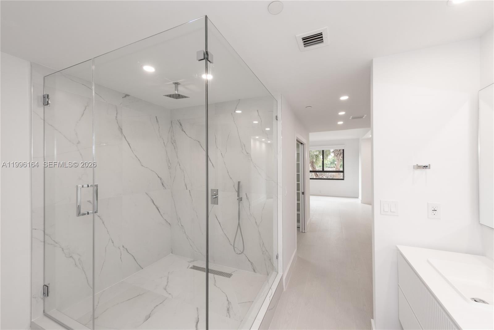 151 Crandon Boulevard, Unit 241 Key Biscayne, FL 33149 - Photo 18 of 28 a bathroom with a bathtub and a shower