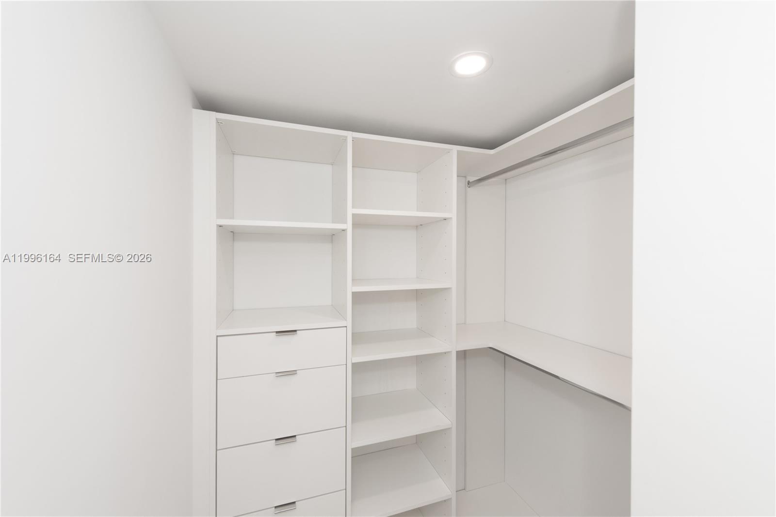 151 Crandon Boulevard, Unit 241 Key Biscayne, FL 33149 - Photo 19 of 28 a view of an empty walk in closet