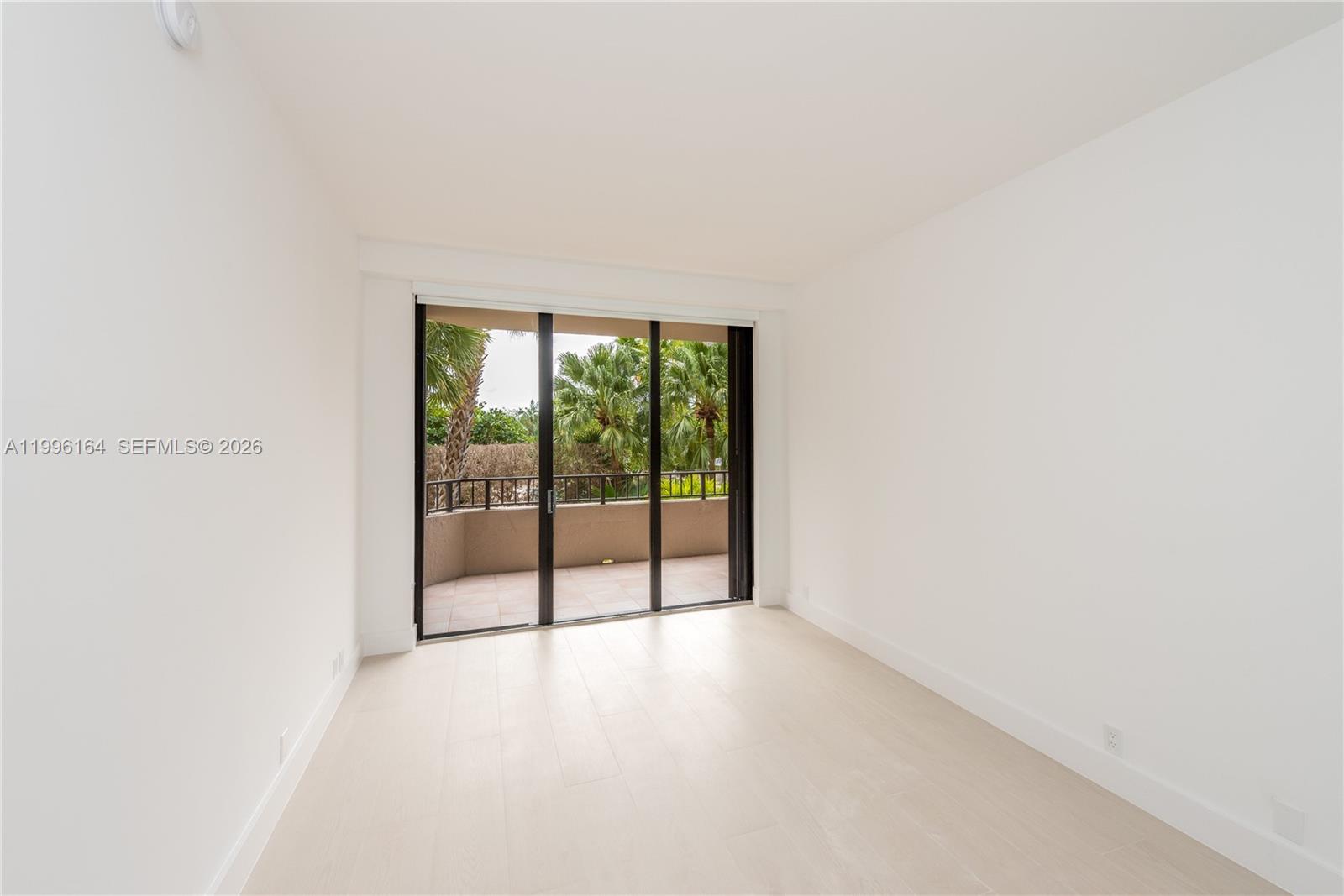 151 Crandon Boulevard, Unit 241 Key Biscayne, FL 33149 - Photo 20 of 28 a view of an empty room with a window