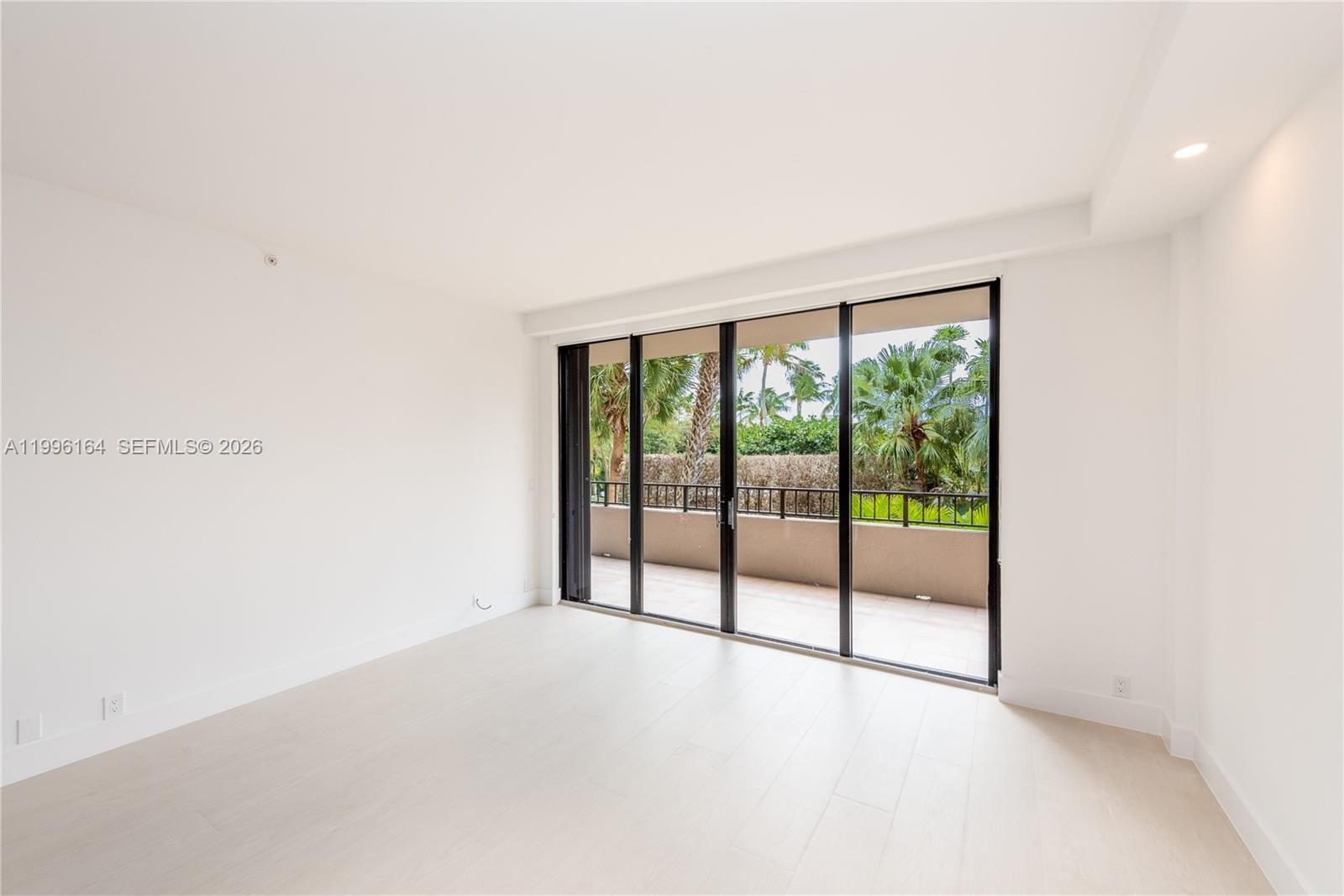 151 Crandon Boulevard, Unit 241 Key Biscayne, FL 33149 - Photo 2 of 28 a view of an empty room with glass door