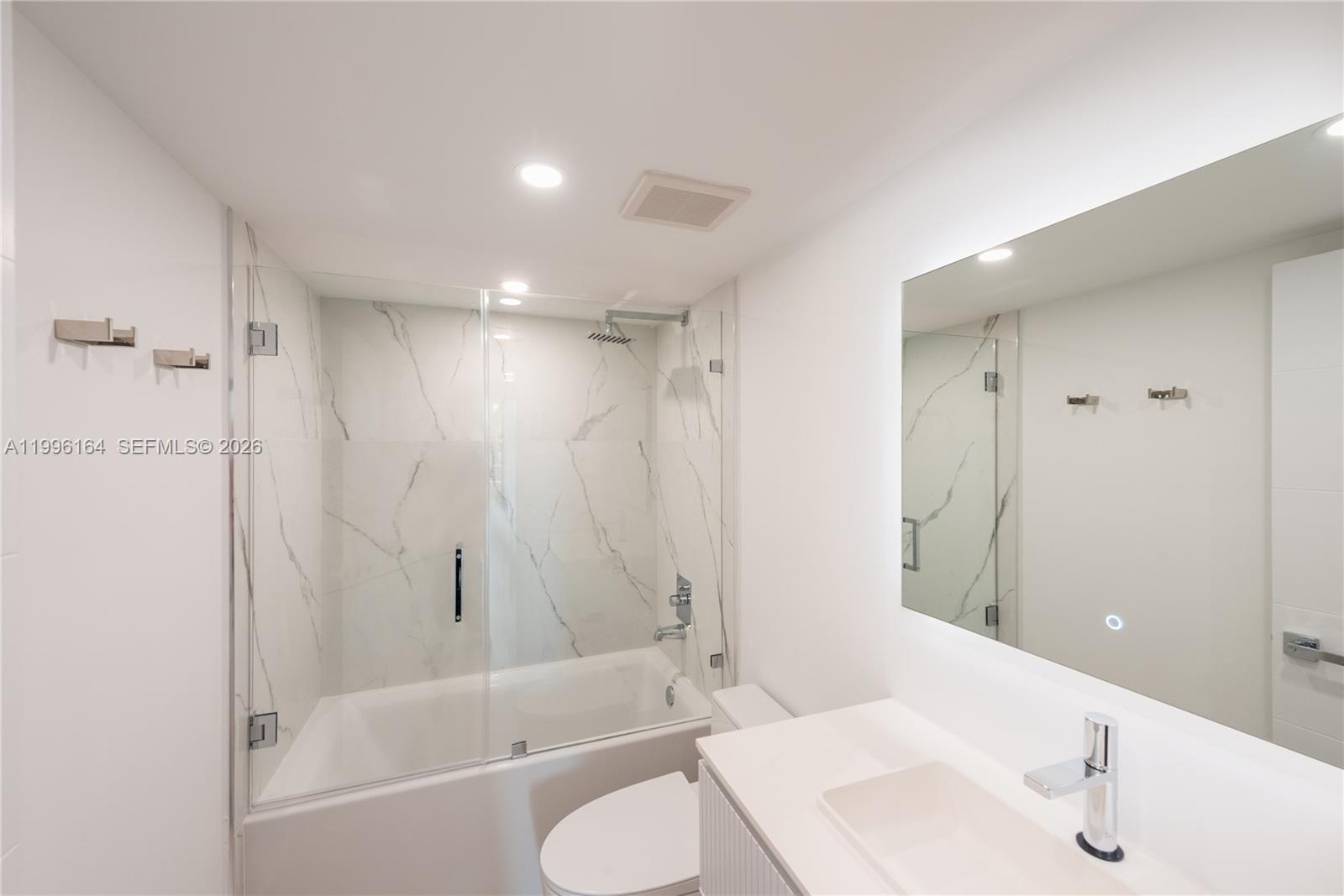 151 Crandon Boulevard, Unit 241 Key Biscayne, FL 33149 - Photo 23 of 28 a bathroom with a sink toilet and shower