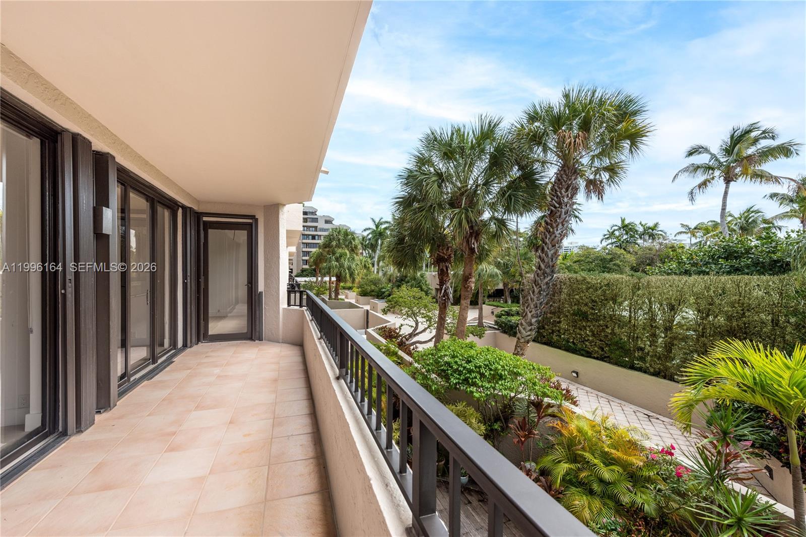 151 Crandon Boulevard, Unit 241 Key Biscayne, FL 33149 - Photo 27 of 28 a view of balcony and yard