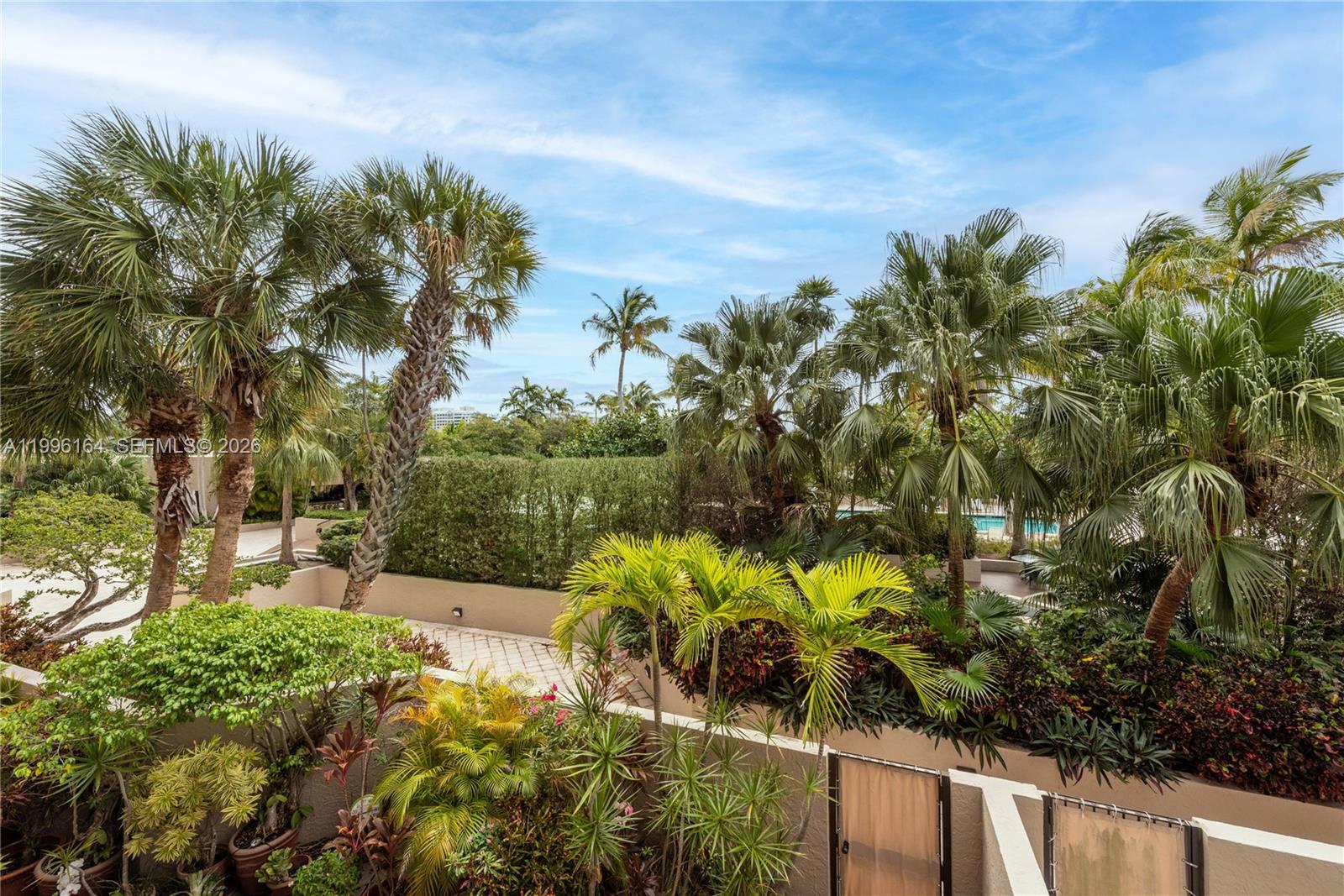 151 Crandon Boulevard, Unit 241 Key Biscayne, FL 33149 - Photo 28 of 28 a view of a yard with plants and large trees