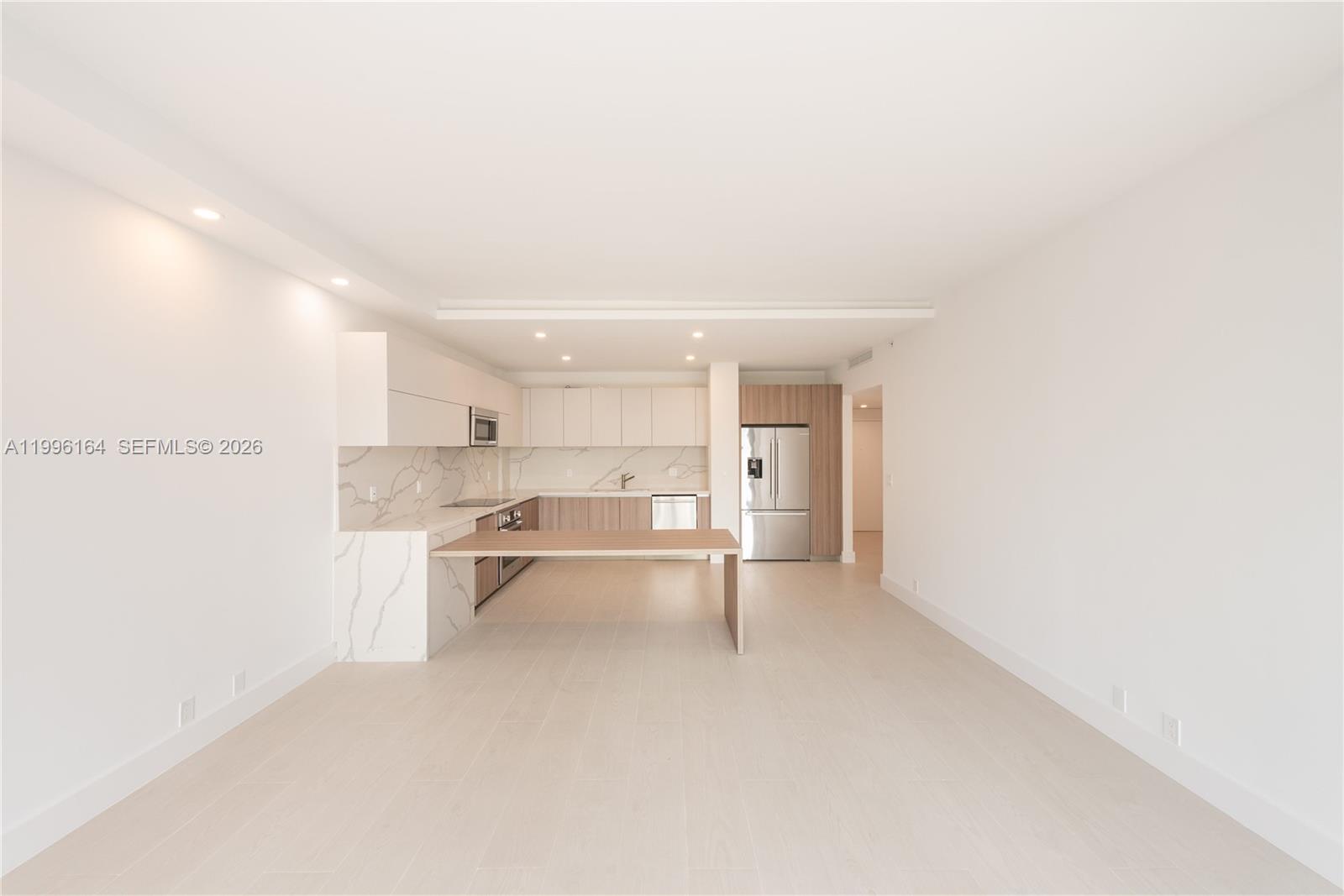 151 Crandon Boulevard, Unit 241 Key Biscayne, FL 33149 - Photo 3 of 28 a view of a kitchen with a sink and cabinets