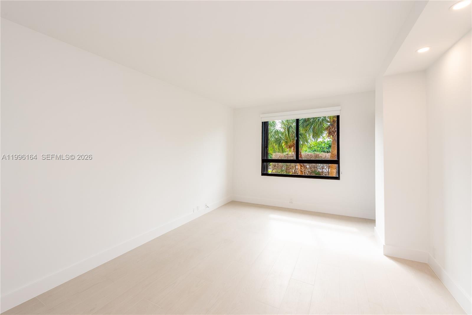 151 Crandon Boulevard, Unit 241 Key Biscayne, FL 33149 - Photo 9 of 28 a view of an empty room with a window