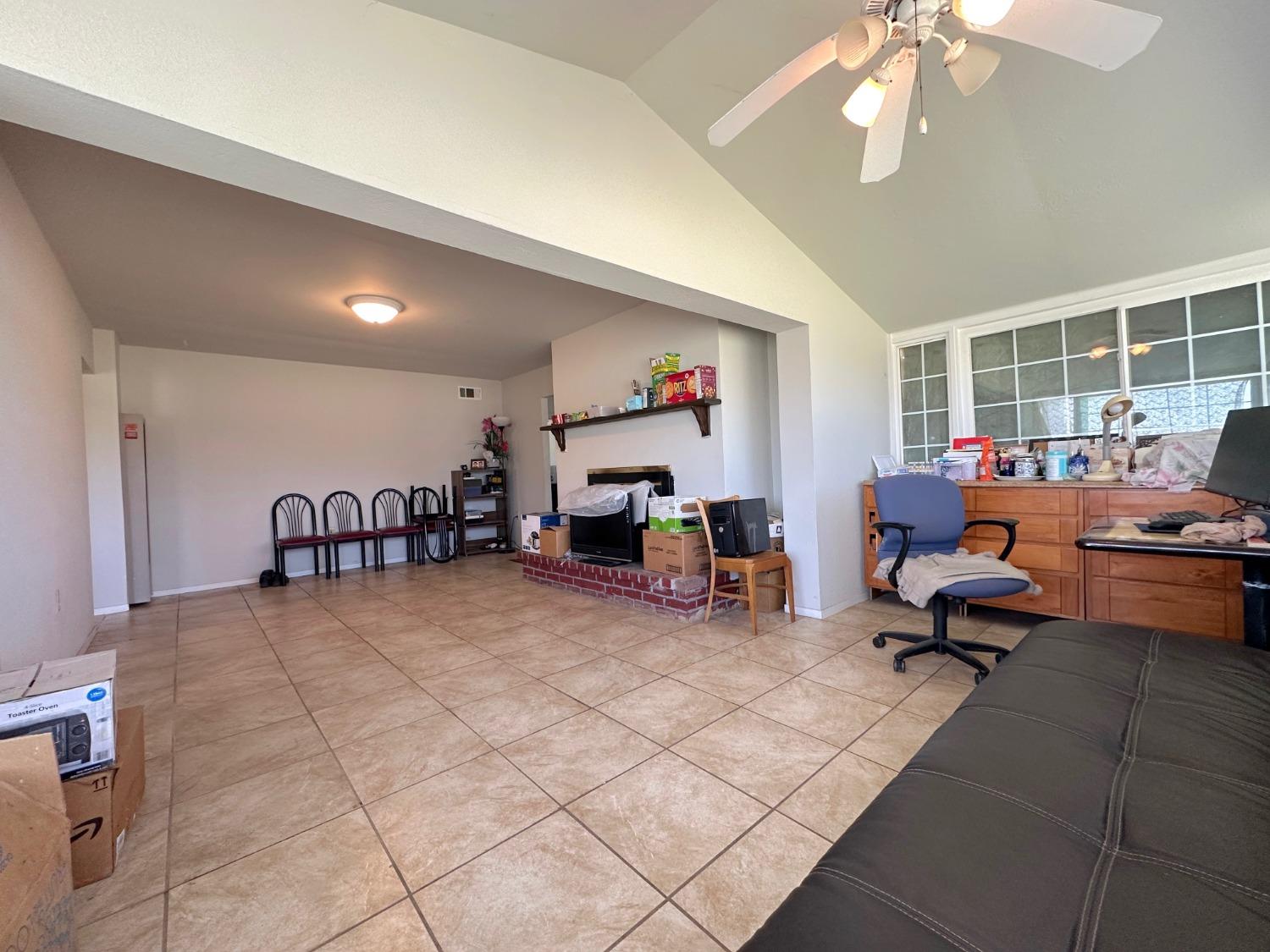 1390 Williamson Road Manteca, CA 95337 - Photo 16 of 27 a work room with furniture and a large window