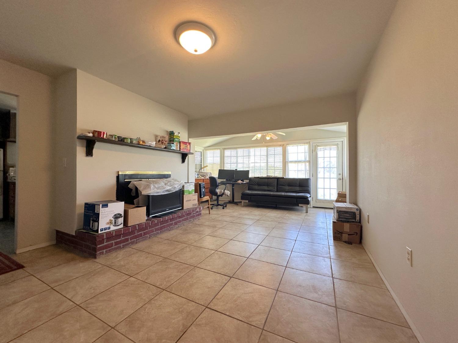 1390 Williamson Road Manteca, CA 95337 - Photo 17 of 27 a living room with furniture and a fireplace