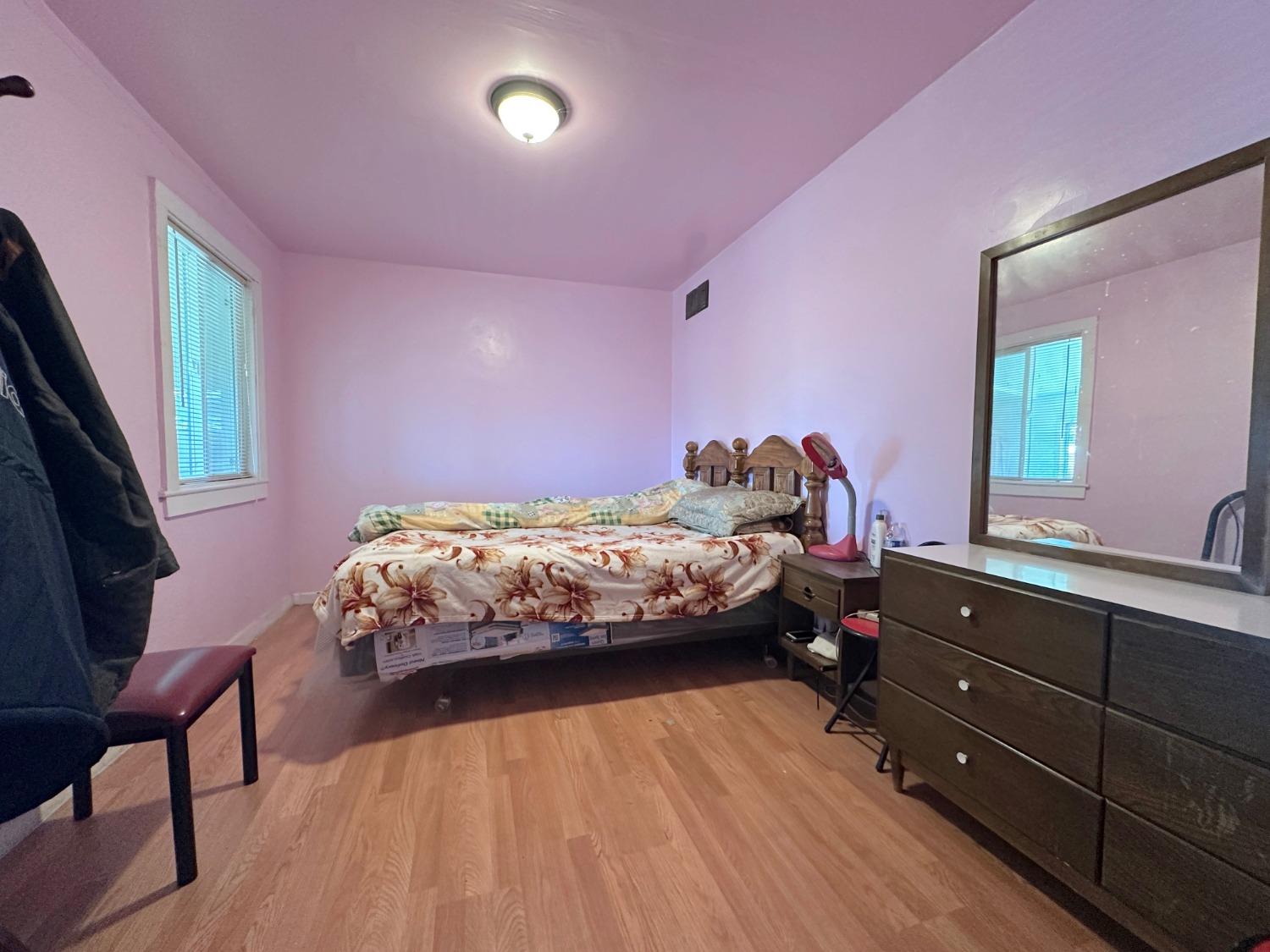 1390 Williamson Road Manteca, CA 95337 - Photo 18 of 27 a bedroom with a bed and a dresser