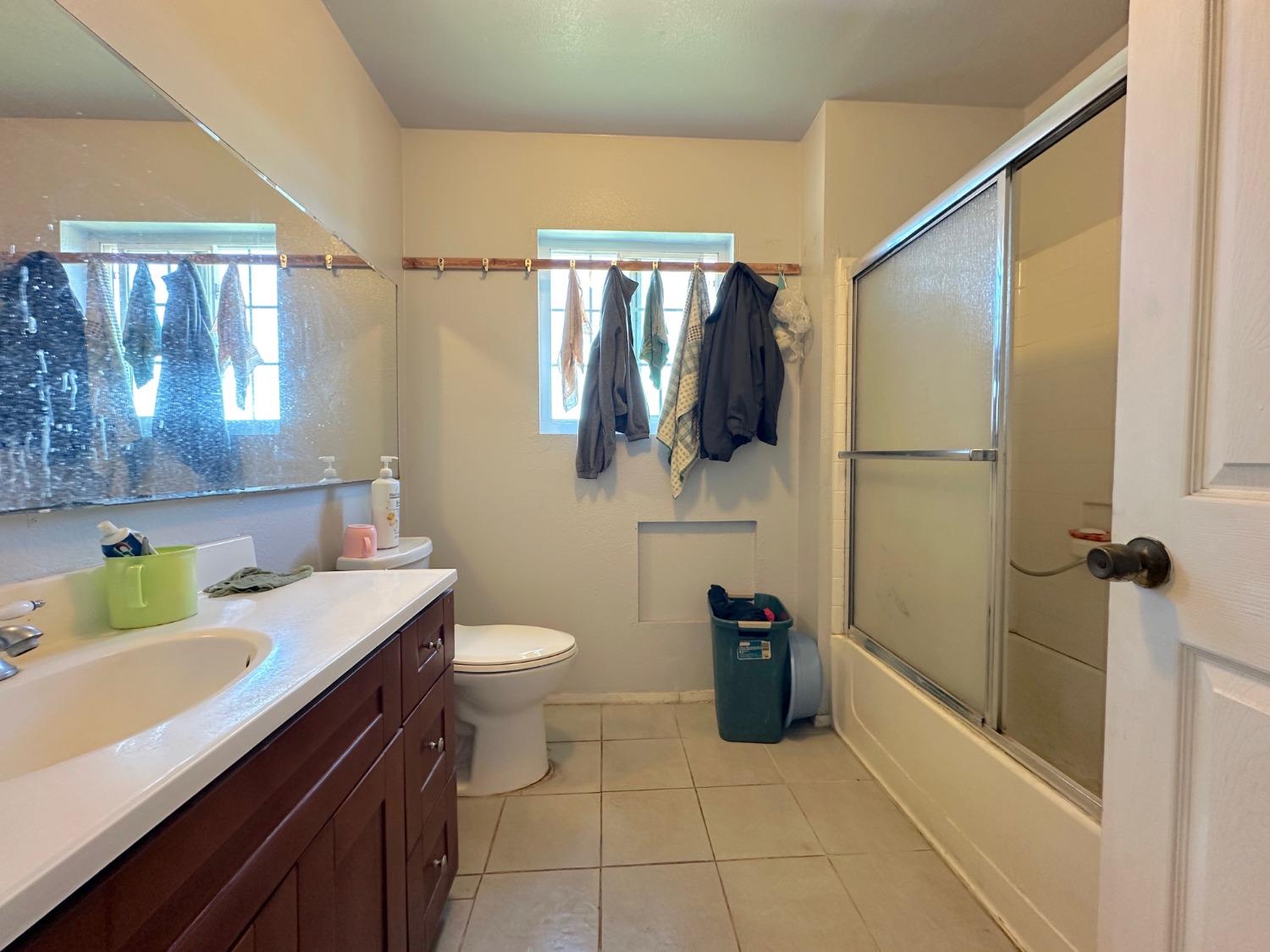 1390 Williamson Road Manteca, CA 95337 - Photo 20 of 27 a bathroom with a sink toilet and shower
