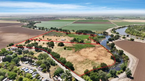 an aerial view of a golf course with parking space