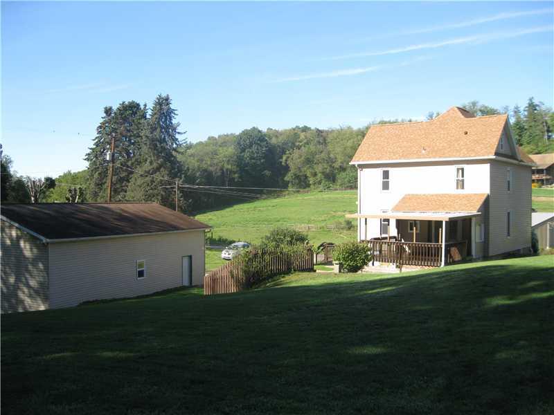 333 Eyth Road Butler, PA 16002 - Photo 6 of 15 Exterior Back. 1 plus acres, just under 2 m/l, behind garage it does go into the woods.