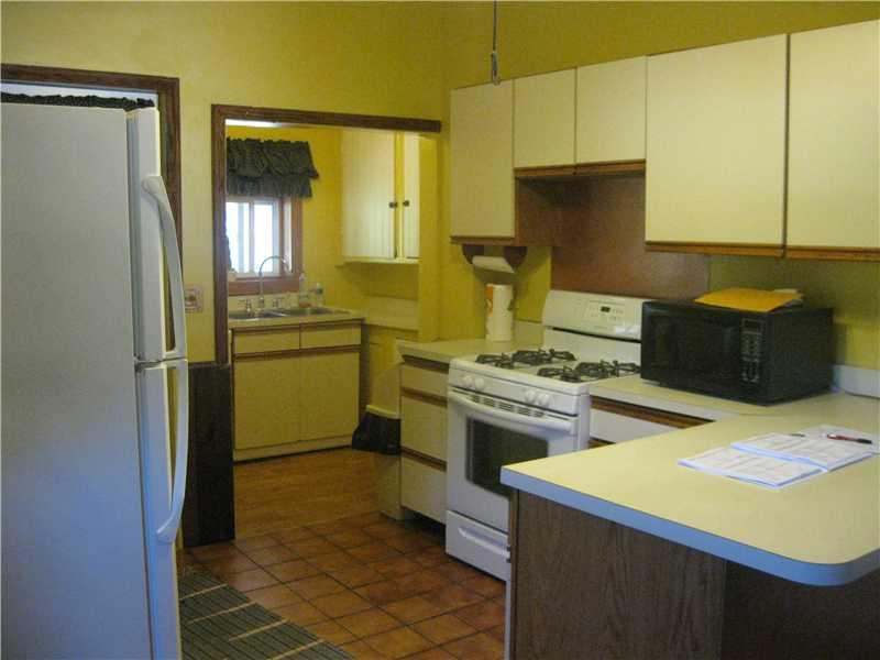 333 Eyth Road Butler, PA 16002 - Photo 8 of 15 Kitchen. Country style, tile floor, back staircase to upstairs, nice amount of counter space for baking, etc.. Kitchen door goes to back covered deck.
