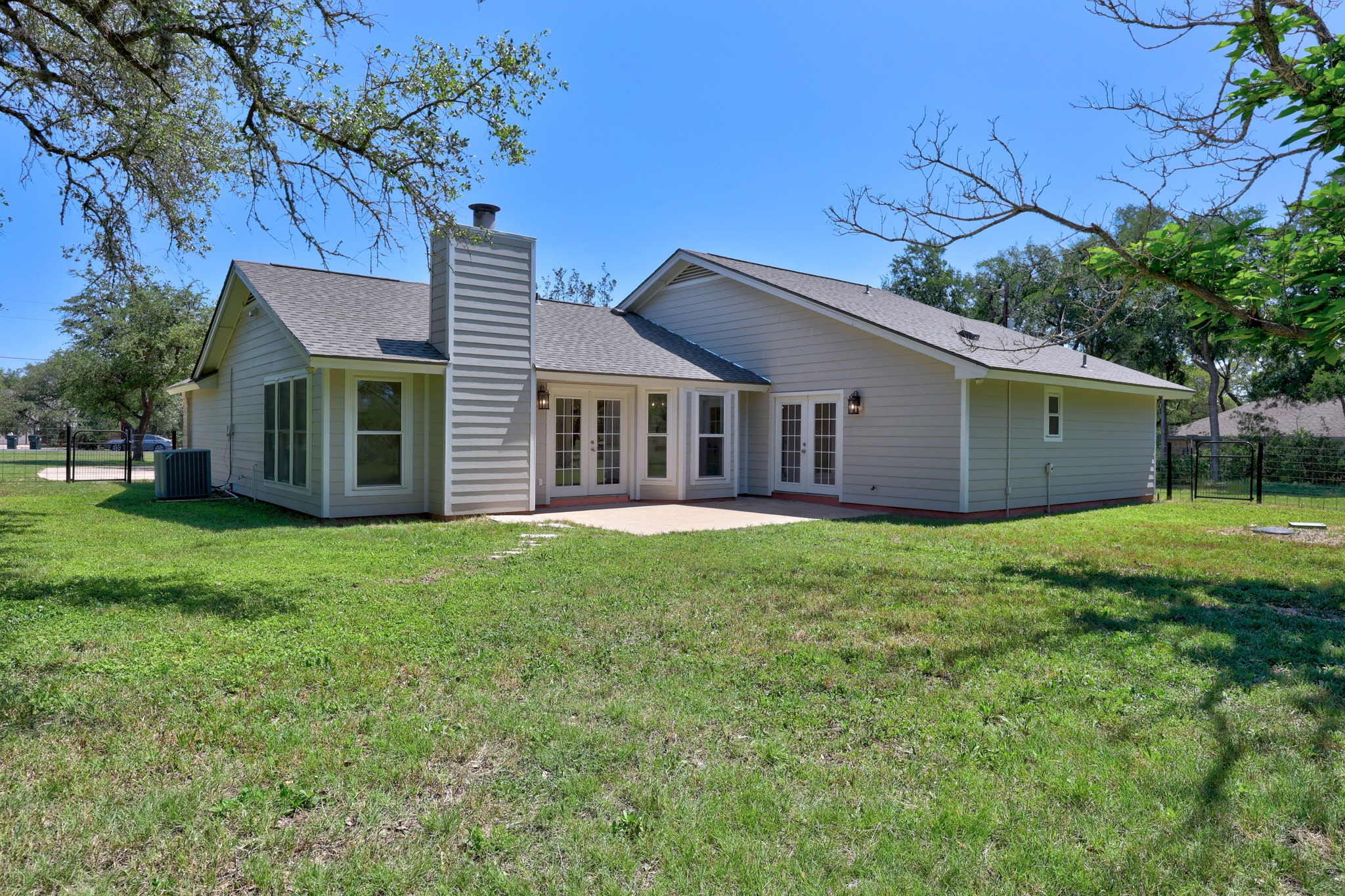 11019 Southwest Oaks Austin, TX 78737 - Photo 29 of 39 The patio overlooks your peaceful acre of lush land.