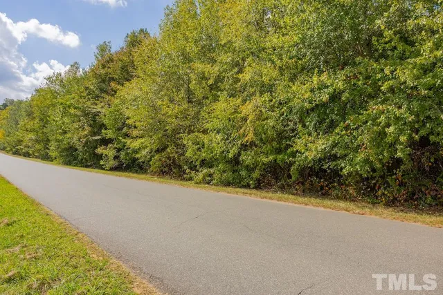 a view of a road with a yard