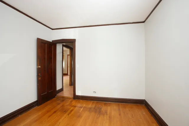 a view of a small space with wooden floor