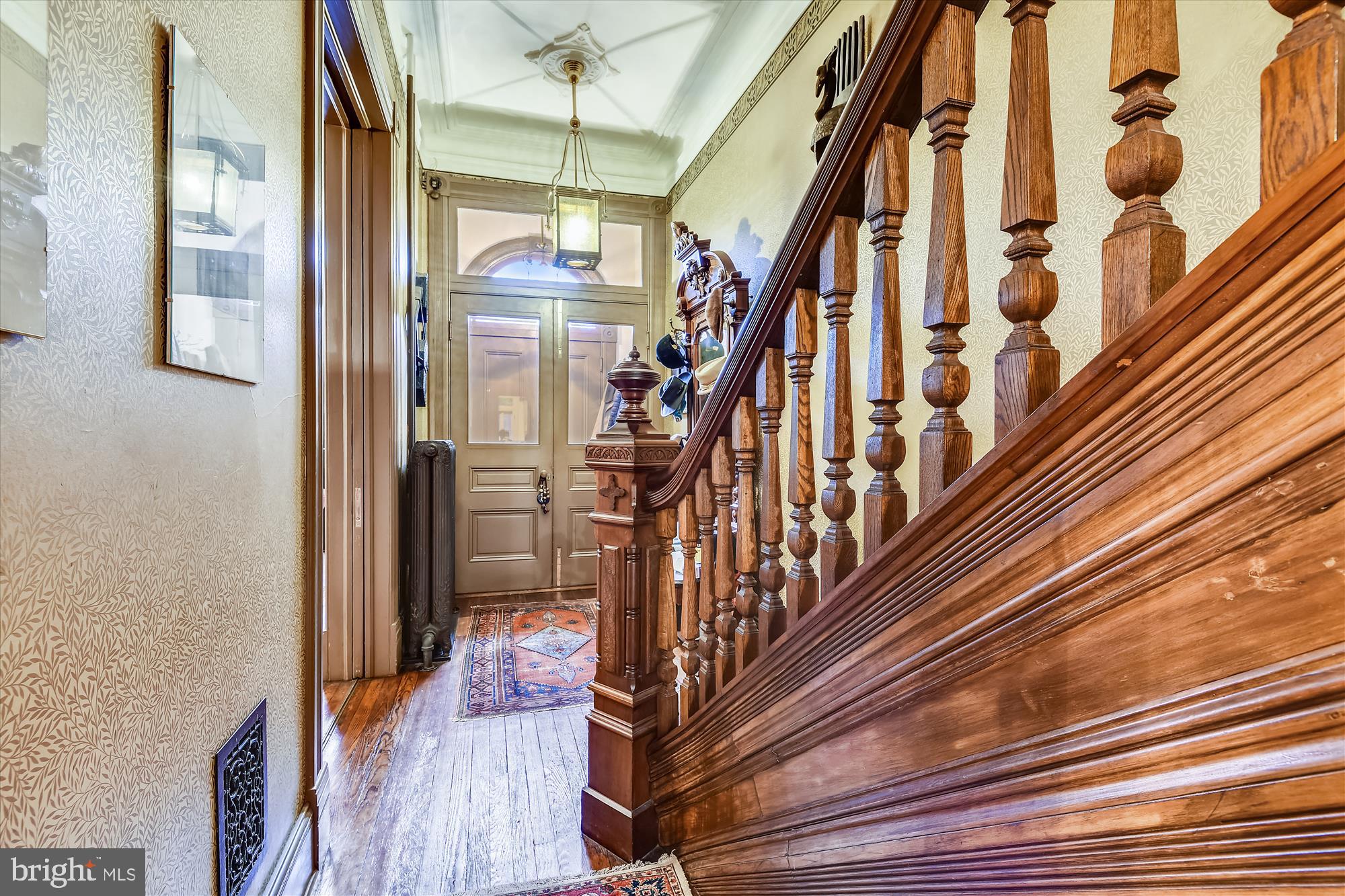 511 Seward Square Southeast Washington, DC 20003 - Photo 5 of 47 a view of staircase with wooden floor and a rug