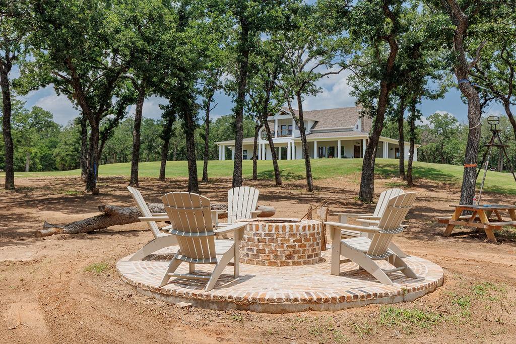 2094 Jim Harry Loop Sunset, TX 76270 - Photo 33 of 40 bricked firepit