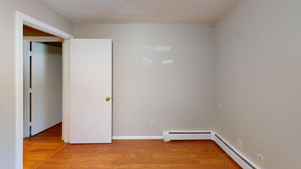 18 Cranston Circle Woburn, MA 01801 - Photo 12 of 19 a view of a room with wooden floor
