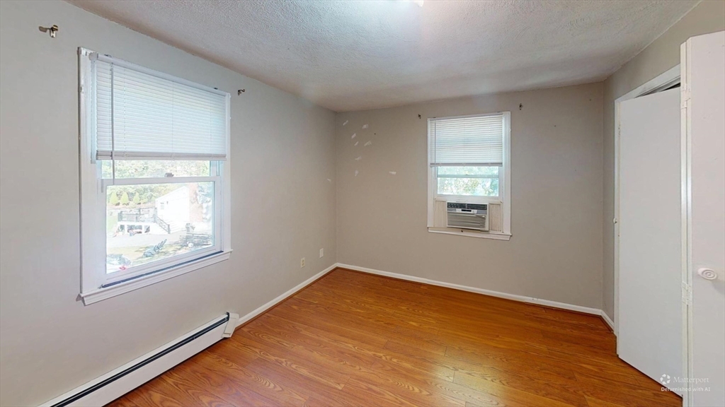 18 Cranston Circle Woburn, MA 01801 - Photo 14 of 19 a view of an empty room with a window