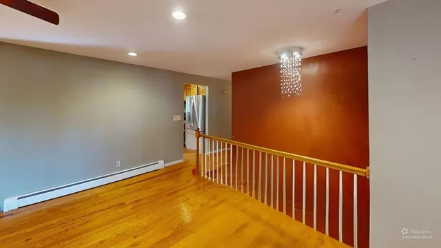 a view of a hallway with a window