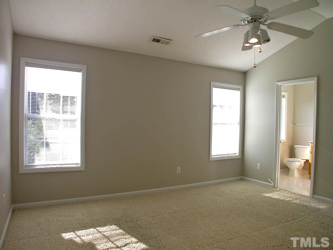 7347 Doverton Court Raleigh, NC 27615 - Photo 12 of 20 a view of an empty room with a window