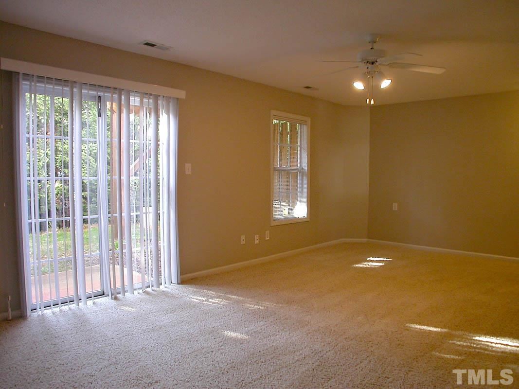7347 Doverton Court Raleigh, NC 27615 - Photo 16 of 20 a view of an empty room with a window