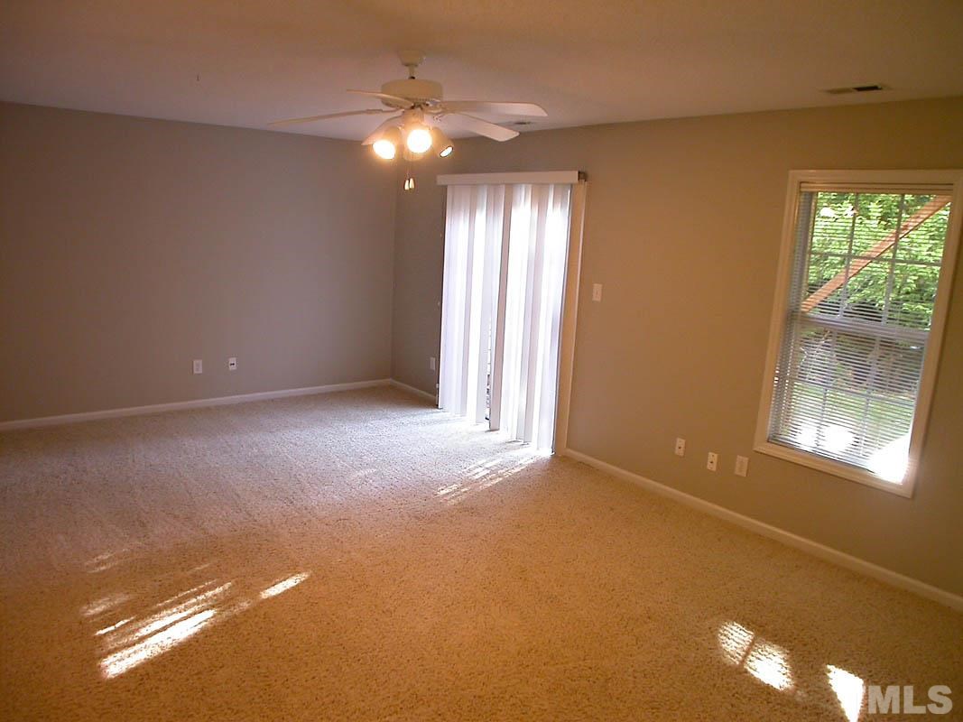 7347 Doverton Court Raleigh, NC 27615 - Photo 17 of 20 a view of an empty room with a window