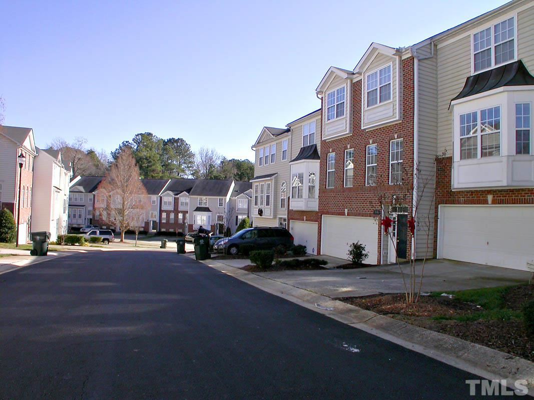 7347 Doverton Court Raleigh, NC 27615 - Photo 20 of 20 a city street lined with tall buildings