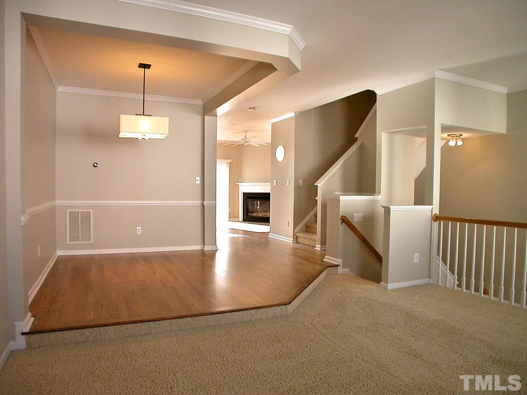 7347 Doverton Court Raleigh, NC 27615 - Photo 5 of 20 a view of a livingroom with a staircase
