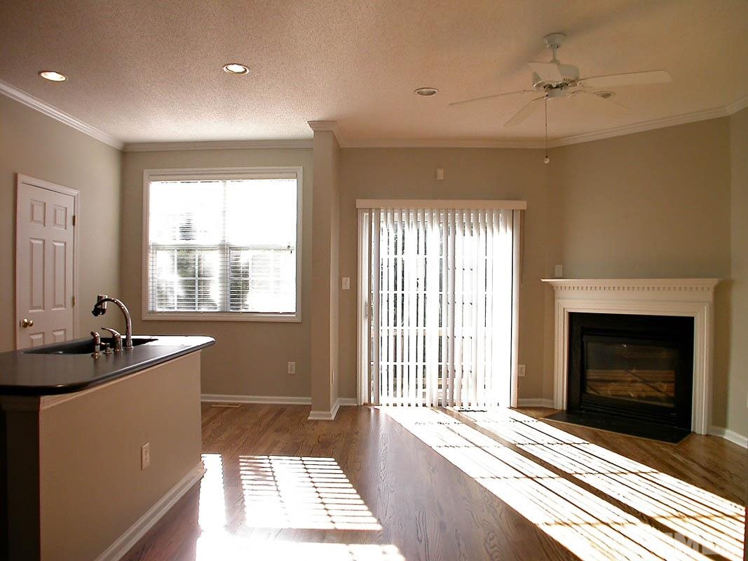 7347 Doverton Court Raleigh, NC 27615 - Photo 7 of 20 a living room with furniture and a fireplace